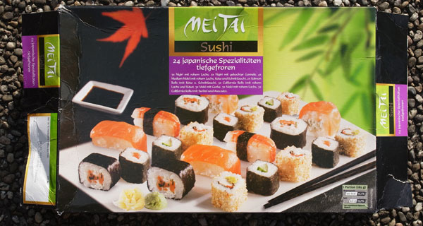 The complete package with a photo of the sushi rolls on the front and a separate description of how many sushi rolls of which type are in the package 